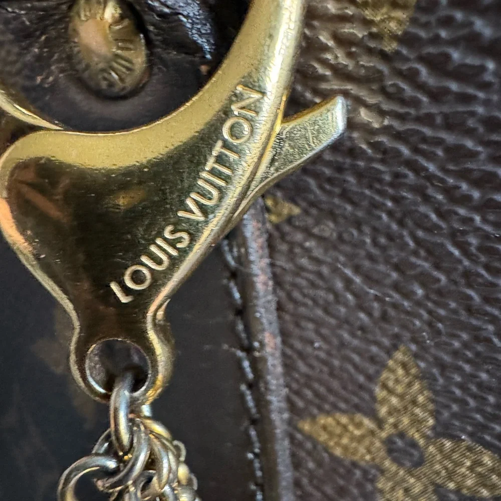 Authentic Louis Vuitton Porte Cles grelots bag charm and key holder